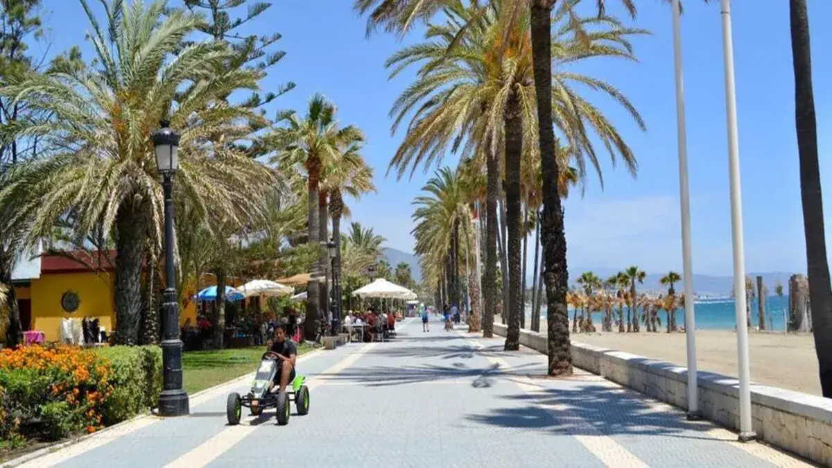 San Pedro de Alcántara boulevard promenade with palm trees and Mediterranean coastline