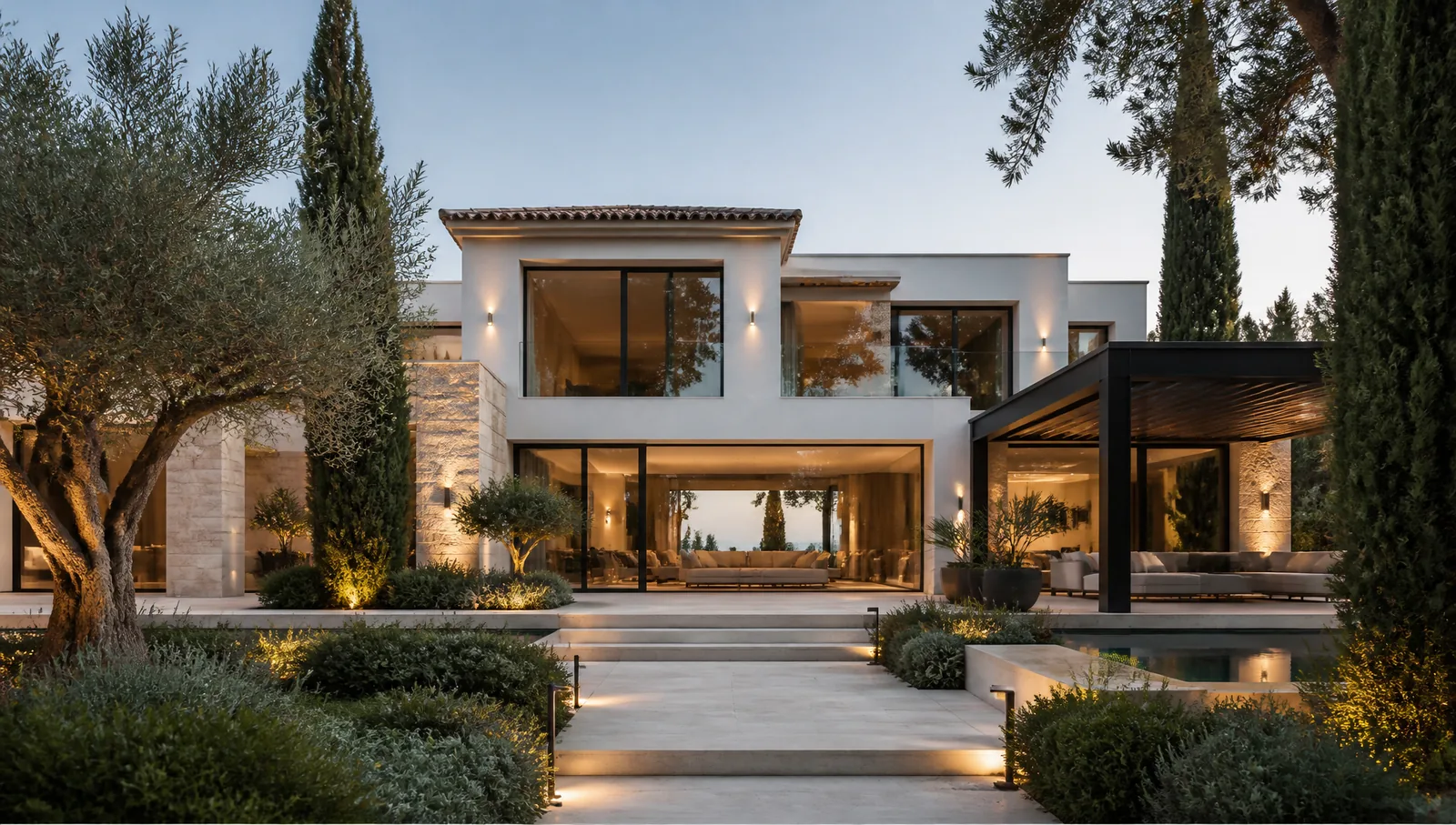 Contemporary Mediterranean house with stone detailing and mature planting in a Golden Mile residential setting