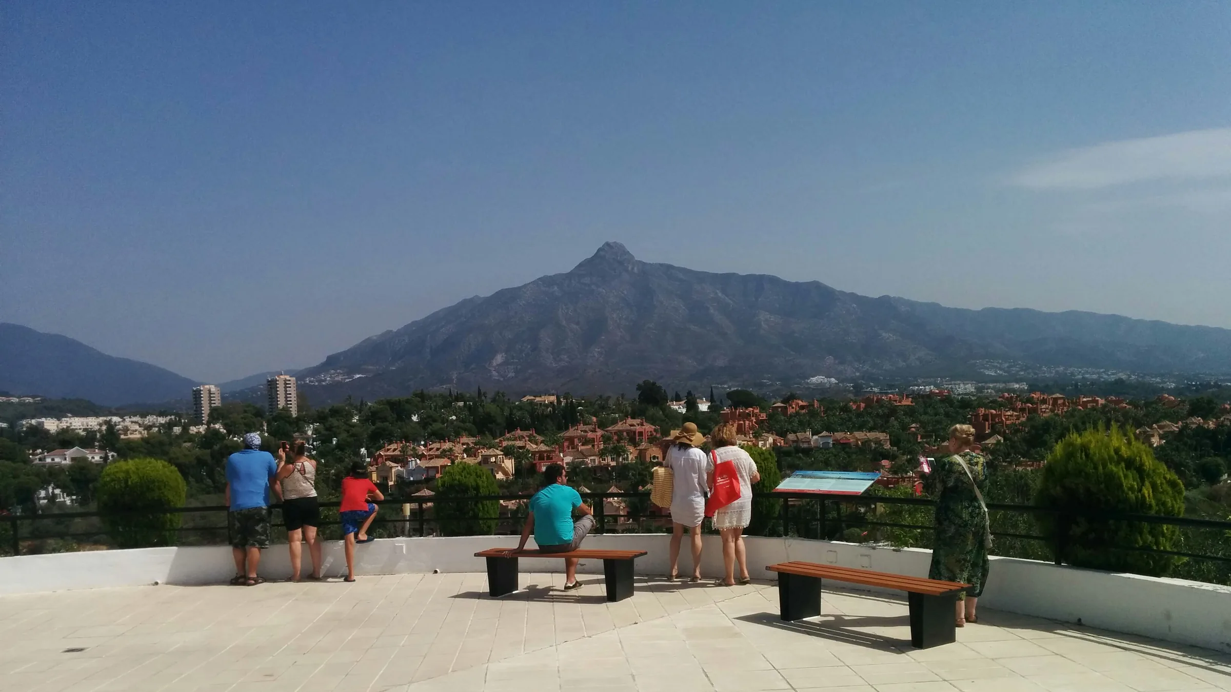 Elevated viewpoint looking across the rooftops of Nueva Andalucía towards La Concha mountain, Marbella