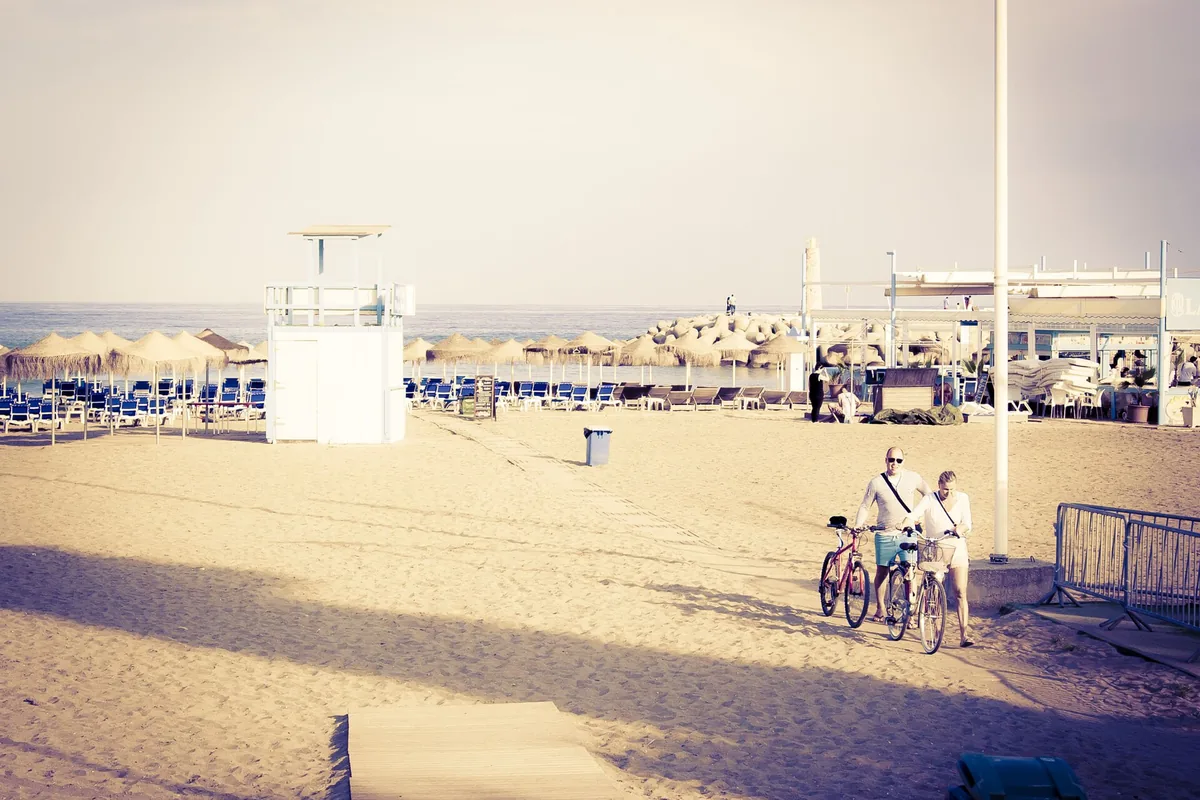 Shoreline and open sand on the beach at Puerto Banús, Marbella