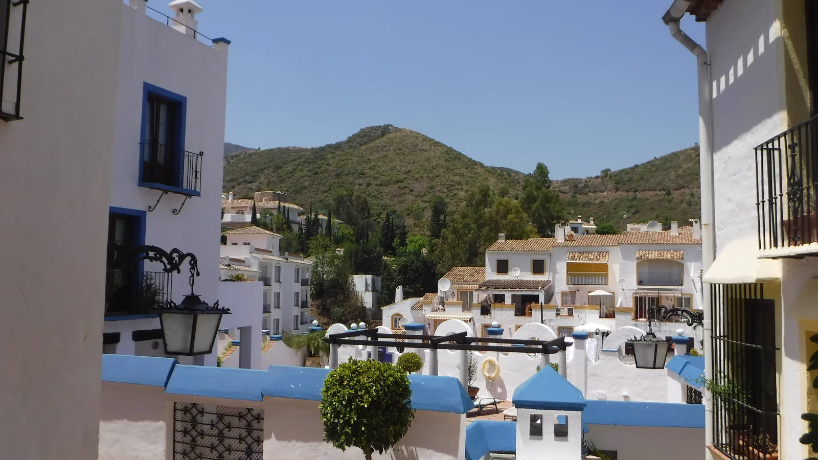 Whitewashed houses on wooded hillsides in Benahavís, the inland municipality where La Zagaleta is located